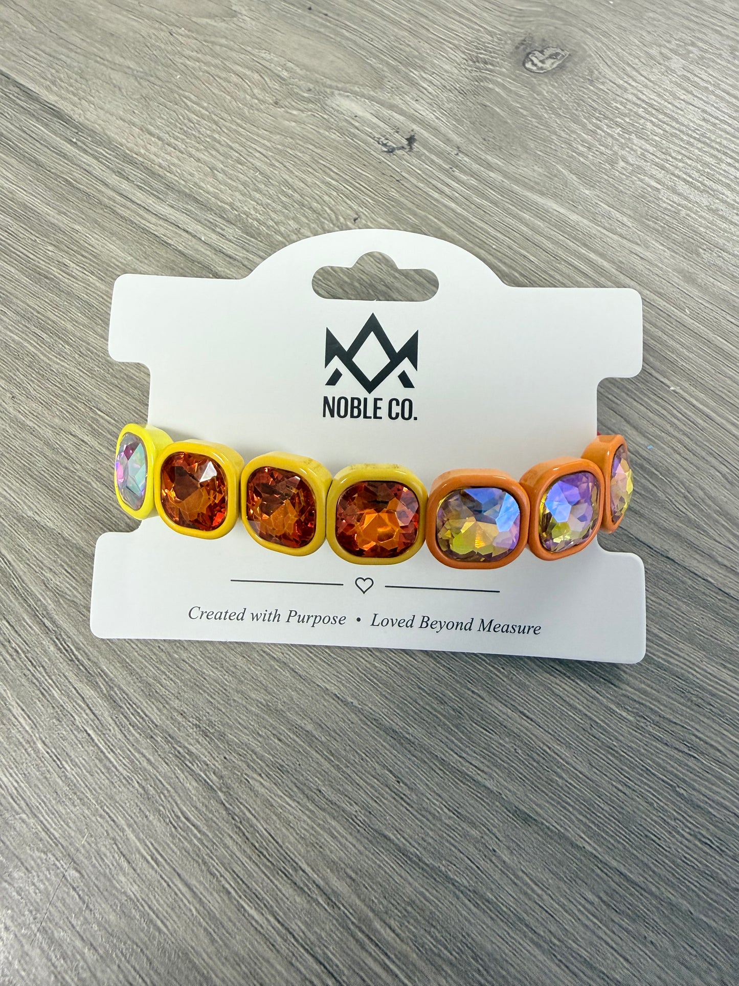 Marlowe Statement Crystal Stretch Bracelet in Sunset by Noble Co. featuring oversized faceted crystals in colorful enamel settings.