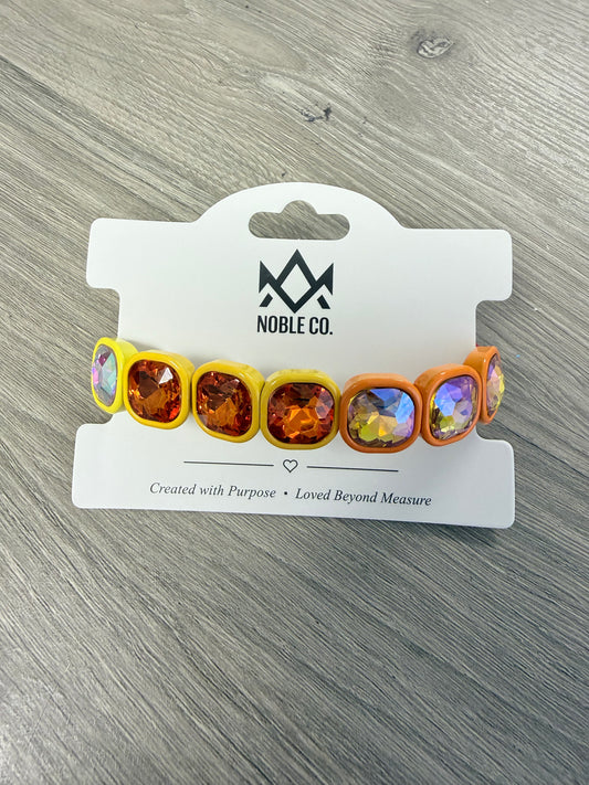 Marlowe Statement Crystal Stretch Bracelet in Sunset by Noble Co. featuring oversized faceted crystals in colorful enamel settings.
